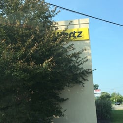 Hertz Rent A Car - May need to trim that overgrown weed/bush.