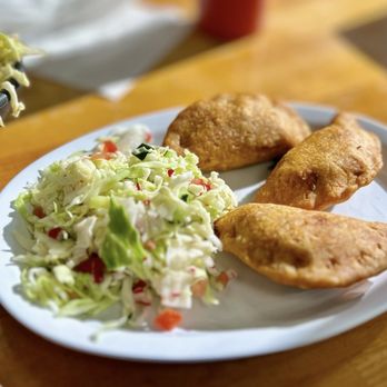 El Buen Gusto Salvadoreño - Pastelitos de pollo with curtido on the side - Salvadoran Near Me - Pittsburg, California El Buen Gusto Salvadoreño - Pastelitos de pollo with curtido on the side - Salvadoran Near Me - Pittsburg, California