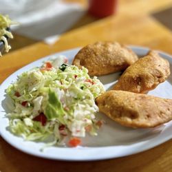 El Buen Gusto Salvadoreño - Pastelitos de pollo with curtido on the side