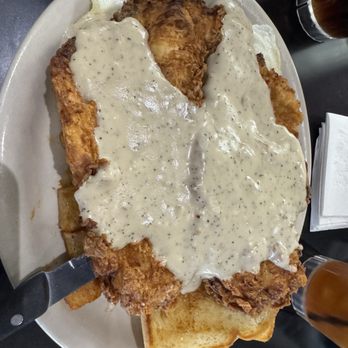 Jonathon's Diner - Chicken fried chicken, eggs over easy and potatoes underneath! - New American Near Me - Dallas, Texas