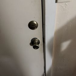 Hanalei Inn - Front door with loose handle and broken deadbolt