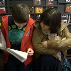 Love Music - Record Store Day customers checking the list of releases, over 450 of them!