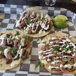 Left to right: Chicken lime taco, brisket taco, pork taco. Left to right: Chicken lime taco, brisket taco, pork taco.