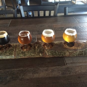 Arizona Wilderness Brewing - L-R Superstition coffee stout, White Canyon Blond, Refuge IPA, Tres Alamos Tripel, Baboquivari Triple Aged In Chardonnay Barrels - Breweries Near Me - Gilbert, Arizona