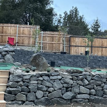 Joe's Yard Service - The natural walls are gorgeous ready to anchor a beautiful garden. We started planting! - Tree Services Near Me - Yakima, Washington