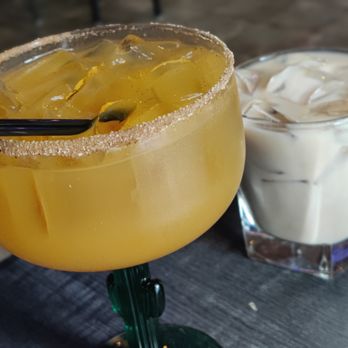 The Establishment - a glass of iced coffee next to a glass of iced coffee - Pizza Near Me - Chelmsford, Massachusetts