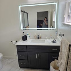 RH Painting and Remodeling - New Mirro Installation and top Counter