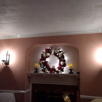 Celtic Construction - a fireplace with a wreath on it - General Contractors Near Me - Linden, New Jersey