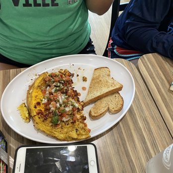 @ The Diner - Tex Mex Omelette w/ bacon added and a side of wheat toast - Breakfast & Brunch Near Me - Orlando, Florida @ The Diner - Tex Mex Omelette w/ bacon added and a side of wheat toast - Breakfast & Brunch Near Me - Orlando, Florida