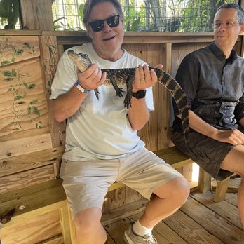Jungle Adventures - Hubby holding alligator. The guide slowly walked through crowd allowing each person to hold and get pictures! - Tours Near Me - Christmas, Florida Jungle Adventures - Hubby holding alligator. The guide slowly walked through crowd allowing each person to hold and get pictures! - Tours Near Me - Christmas, Florida