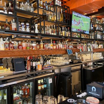 Quandary Grille - a bar with many bottles of liquor - American Near Me - Breckenridge, Colorado Quandary Grille - a bar with many bottles of liquor - American Near Me - Breckenridge, Colorado