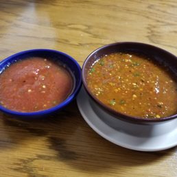 two bowls of salsa and a drink two bowls of salsa and a drink