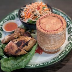 Combo set of gai yang som tom (half thai style grilled chicken and papaya salad) served with sticky rice