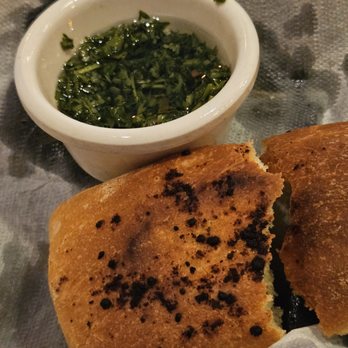 Portobello's Cuisine - Bread and chimichurri sauce. Delicious!!! - Italian Near Me - Montrose, California Portobello's Cuisine - Bread and chimichurri sauce. Delicious!!! - Italian Near Me - Montrose, California