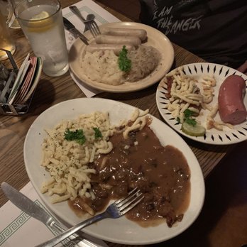 Resi's Bierstube Restaurant - Jagerschnitzel with spaetzle in the front. 3 weisswurst sausages & one Knockwurst. - German Near Me - Chicago, Illinois Resi's Bierstube Restaurant - Jagerschnitzel with spaetzle in the front. 3 weisswurst sausages & one Knockwurst. - German Near Me - Chicago, Illinois