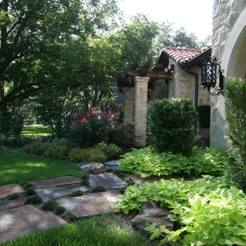 Palm Gardens - a view of the front of a house - Landscaping Near Me - Dallas, Texas Palm Gardens - a view of the front of a house - Landscaping Near Me - Dallas, Texas