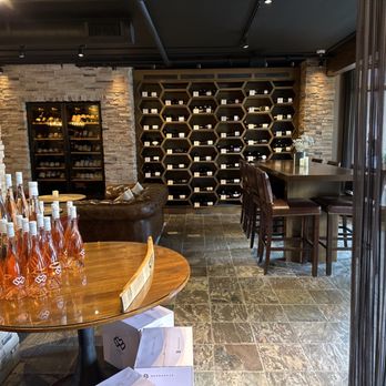 Stave Wine Cellar - wine bottles on a table - Wine Bars Near Me - Pebble Beach, California