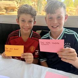 DNA Prep Academy - Students creating kindness cards and lunch bags for the homeless during World Peace Day.
