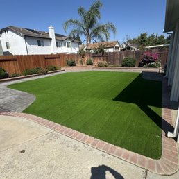New Ultra Play Turf and new stamped concrete walkway around turf.