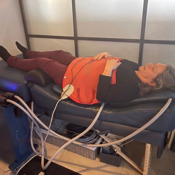 Jolt PEMF Lab - Getting a heated red LED light on my stomach and electrical pads underneath my body. - Alternative Medicine Near Me - Scottsdale, Arizona