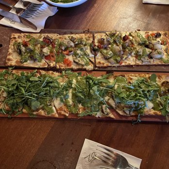 Seasons 52 - Chicken Pesto Chicken and Fresh Mozzarella. One with arugula. - New American Near Me - Costa Mesa, California