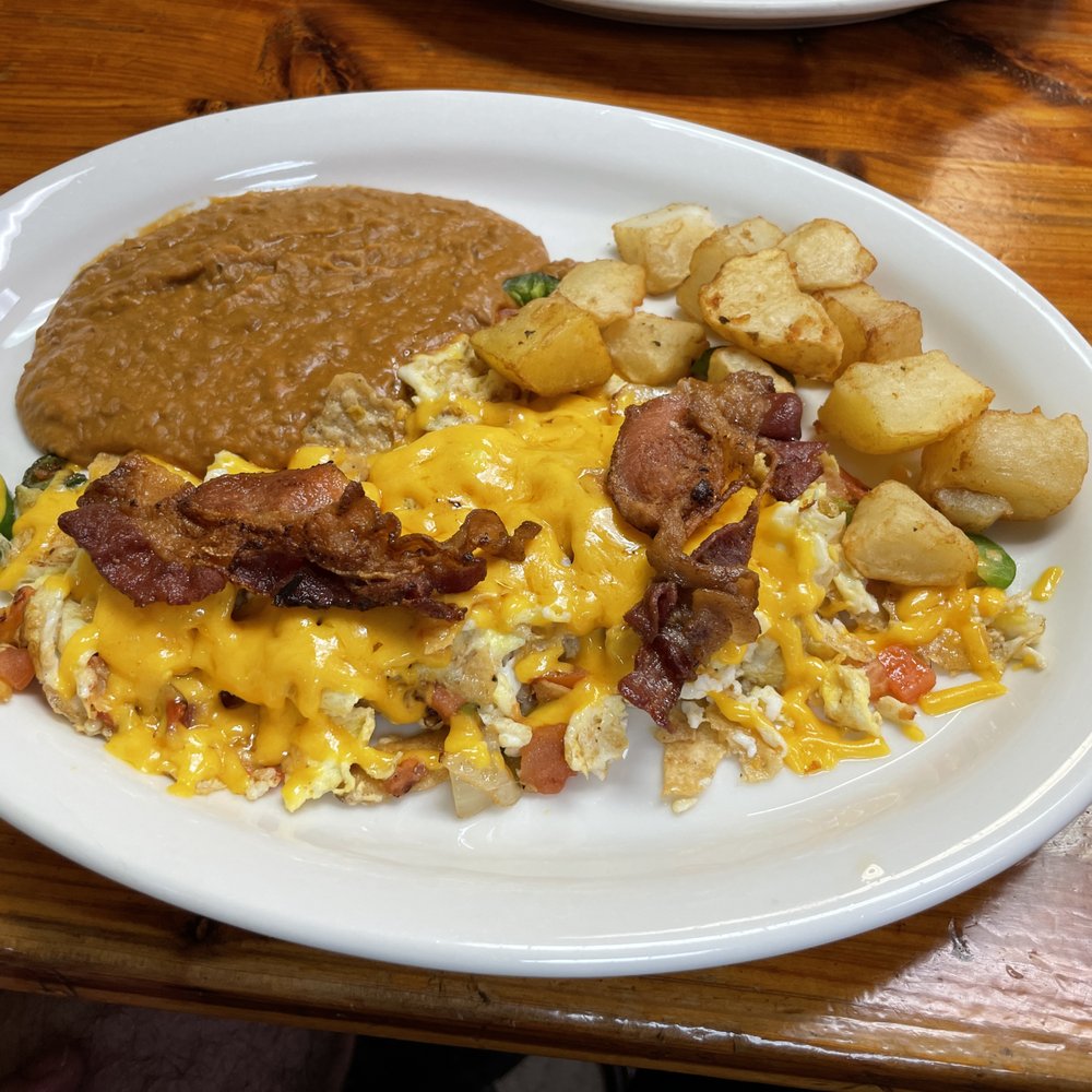 El Rancho - Migas plate with Bomb beans, bacon and taters - Mexican Near Me - Bertram, Texas El Rancho - Migas plate with Bomb beans, bacon and taters - Mexican Near Me - Bertram, Texas