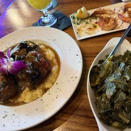 Oxtails over mashed potatoes. Collard greens Oxtails over mashed potatoes. Collard greens