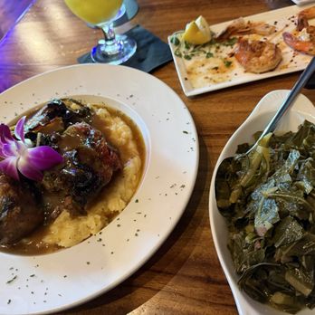 Tryst Kitchen + Cocktails - Oxtails over mashed potatoes. Collard greens - Cajun/Creole Near Me - San Antonio, Texas Tryst Kitchen + Cocktails - Oxtails over mashed potatoes. Collard greens - Cajun/Creole Near Me - San Antonio, Texas