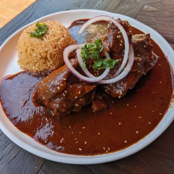 Las Guerreras - Chicken Mole Rojo Plate -- 17 Chicken thigh and drum stick in mole rojo sauce. - Breakfast & Brunch Near Me - Oakland, California Las Guerreras - Chicken Mole Rojo Plate -- 17 Chicken thigh and drum stick in mole rojo sauce. - Breakfast & Brunch Near Me - Oakland, California