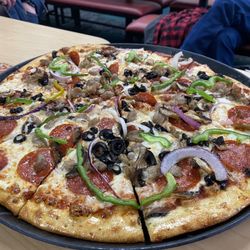 Surprisingly good pizza with a crunchy crust. Great place for kids bday parties.