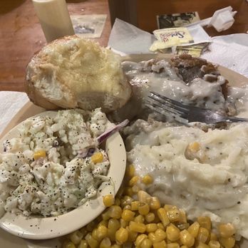 Lambert's Cafe - Chicken fried round steak smothered in white gravy served with mashed potatoes, corn and slaw and a HUGE ROLL. - Seafood Near Me - Foley, Alabama Lambert's Cafe - Chicken fried round steak smothered in white gravy served with mashed potatoes, corn and slaw and a HUGE ROLL. - Seafood Near Me - Foley, Alabama