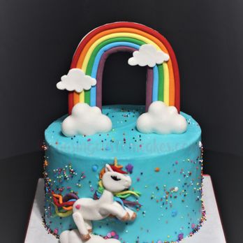 Chasing Custom Cakes - a cake with a rainbow and clouds - Custom Cakes Near Me Chasing Custom Cakes - a cake with a rainbow and clouds - Custom Cakes Near Me