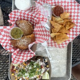 Ground beef and rice bowl (bottom) Empanada (left) Spicy chicken burrito and chips (right) Ground beef and rice bowl (bottom) Empanada (left) Spicy chicken burrito and chips (right)