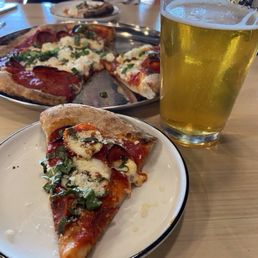 Pepperoni pizza and a beer. Perfect size for the two of us. Pepperoni pizza and a beer. Perfect size for the two of us.