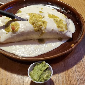 Amigos Mexican Restaurant - The panther burrito!!  The flavors mix perfectly together!! Steak, Chrizzo, chicken,shrimp, rice, beans fajita style veg . Wow!! - Mexican Near Me - Waterloo, Iowa