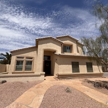 Tacheny Exteriors - Completed tile roof replacement project, ground-level view of the finished home in Chandler, AZ. - Roofing Near Me - Phoenix, Arizona Tacheny Exteriors - Completed tile roof replacement project, ground-level view of the finished home in Chandler, AZ. - Roofing Near Me - Phoenix, Arizona