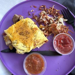 Meat lovers omelette with hash browns well done. This was JUST half! The omelette was MASSIVE