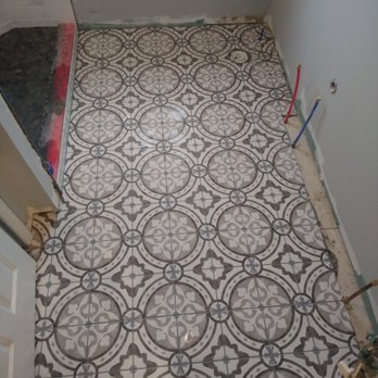 STS Renovation - a tile floor in a bathroom - General Contractors Near Me