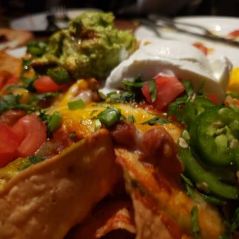 Yard House - Nachos. Yum but some dry chicken 7.5 / 10 - New American Near Me - Seattle, Washington Yard House - Nachos. Yum but some dry chicken 7.5 / 10 - New American Near Me - Seattle, Washington