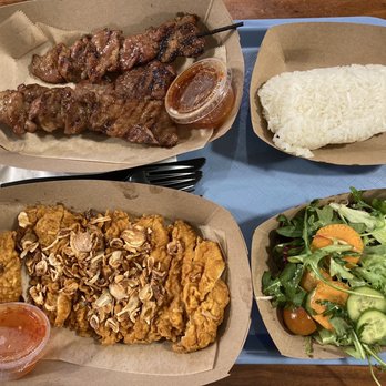 Three Monkeys - Pork Skewers and Hat Yai Fried Chicken with sticky rice and a side salad - Thai Near Me - Santa Barbara, California