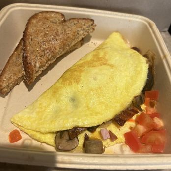 First Watch - "The Works" omelette served with toast and fresh diced tomatoes - Breakfast & Brunch Near Me - Glendale, Arizona