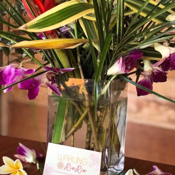 Warung RieRie - Flower arrangement on table - Indonesian Near Me Warung RieRie - Flower arrangement on table - Indonesian Near Me