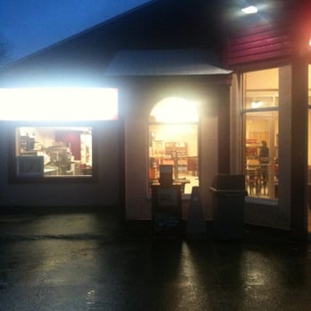 Dunkin' -  the outside of a restaurant at night - Donuts Near Me - Kingston, Rhode Island
