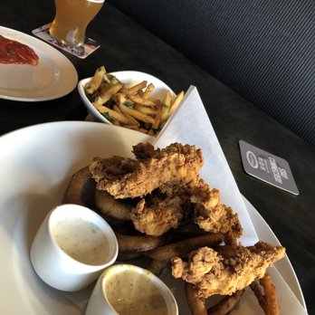 Yard House - Chicken strips and onion rings, yum - New American Near Me - Carlsbad, California Yard House - Chicken strips and onion rings, yum - New American Near Me - Carlsbad, California