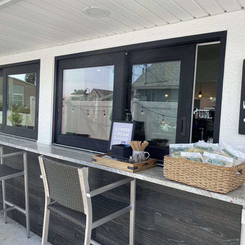 Postal 98 Cafe - Bar seating by pick up window - Coffee & Tea Near Me - Sarasota, Florida Postal 98 Cafe - Bar seating by pick up window - Coffee & Tea Near Me - Sarasota, Florida