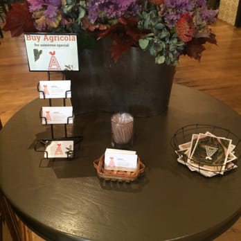 Agricola Eatery - Entrance table, beautiful flowers and business cards. - New American Near Me - Princeton, New Jersey
