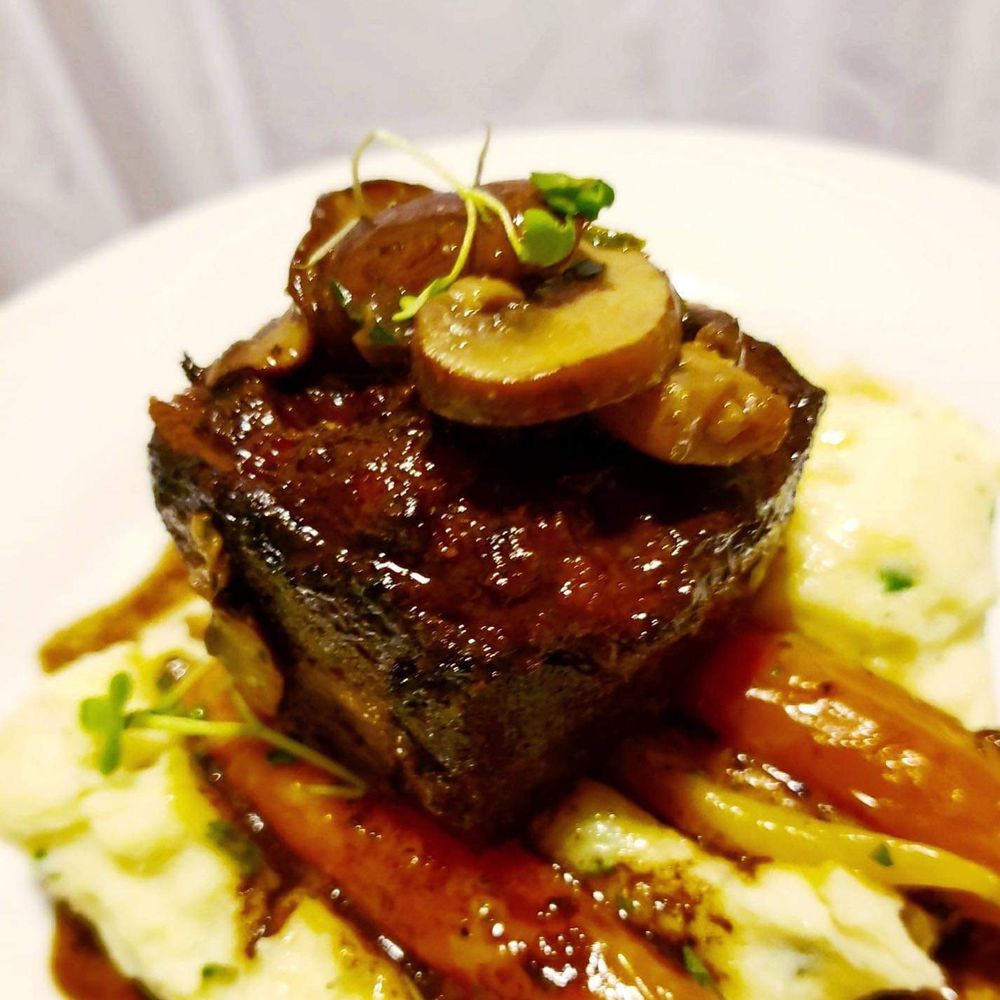 A Wayfaring Chef - Amazing beef entree we chose: beef short ribs - Caterers Near Me