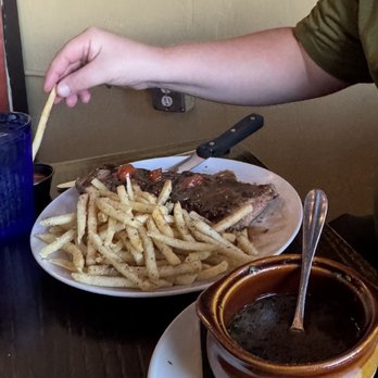 Julia’s Bistro & Bar - NY Strip steak with some kind of brown gravy type sauce - French Near Me - San Antonio, Texas Julia’s Bistro & Bar - NY Strip steak with some kind of brown gravy type sauce - French Near Me - San Antonio, Texas