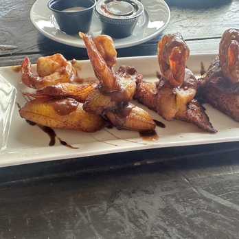 Toroverde - Camarones Loíza 12  An original, grilled shrimp finished in a scrumptions 17 ingredients jerk sauce and served over ripe plantains. - Ziplining Near Me - Orocovis, Puerto Rico