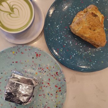 Archetype Coffee - Matcha latte with oat milk, tomato scone (top right), and griddle sandwich (bottom left). - Coffee Roasteries Near Me - Omaha, Nebraska